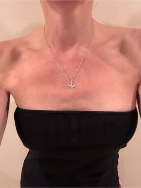 Authentic Vivienne  Westwood mini Bas relief silver pendent with crystals.
